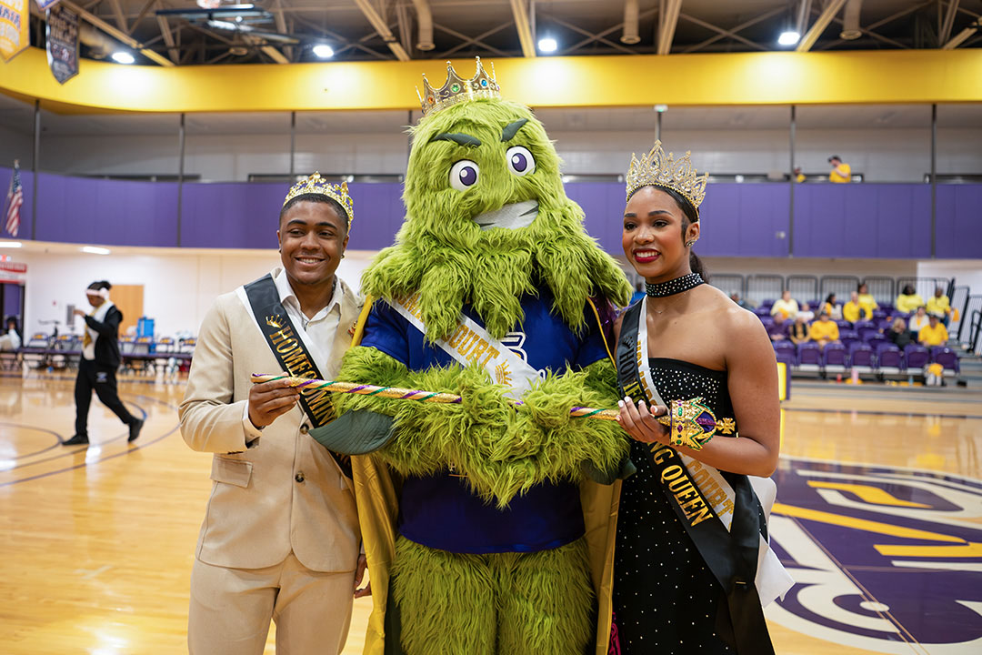 LSUS Homecoming king and queen pose with Rev the River Monster