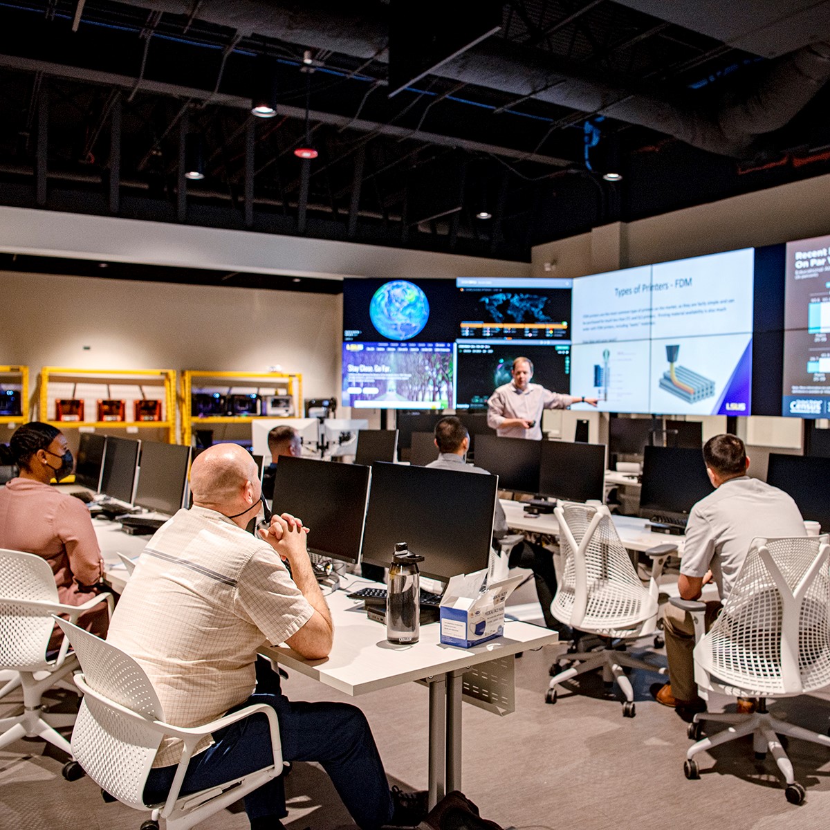 scott isaacs, director of the lsus cyber collaboratory, speaks to a group inside the collab command center